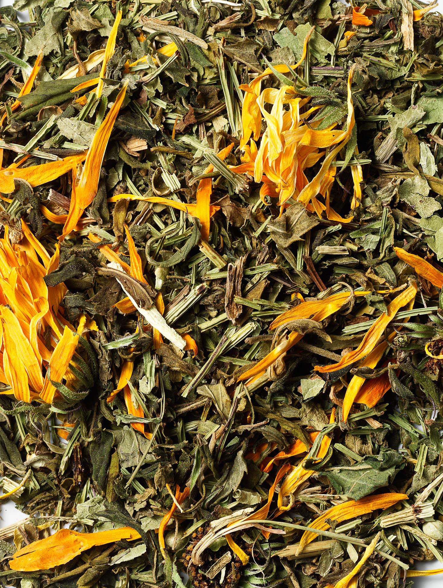 Close-up of dried tea with orange flower leaves.